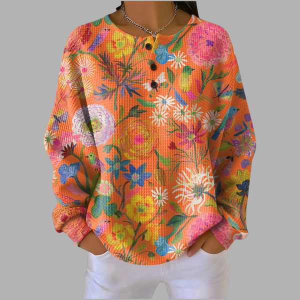 A minha loja 2 blusa feminina de manga comprida com estampa floral colorida, tecido texturizado e botões frontais.