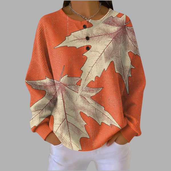 Blusa de moletom A minha loja 2 laranja com estampa de folhas de outono, tecido texturizado e gola com botões.